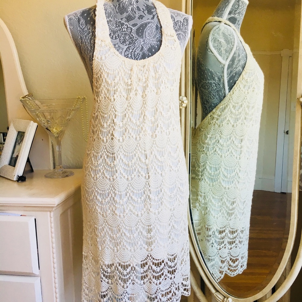 Cream crocheted dress with low back.